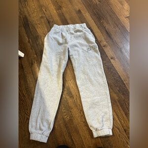 Brandy Melville cuffed grey Rosa sweatpants with green New York